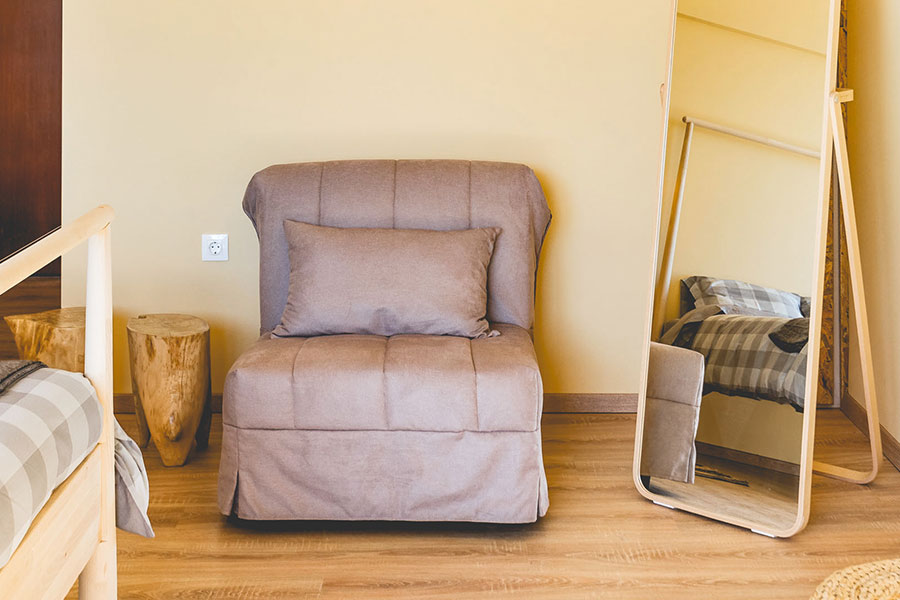 Sofa, mirror and wooden floor