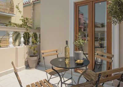 Balcony with table and wooden chair