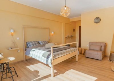 Wooden double bed in Saphire apartment